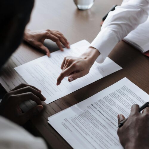 pexels-ron-lach-9870217 Hands pointing at paper documents